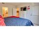 Spacious main bedroom with a TV, closet, and doorway to the kitchen at 1230 S Missouri Ave # 704, Clearwater, FL 33756
