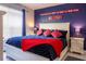 Coastal style main bedroom with colorful bedding and decoratively painted accent wall at 1230 S Missouri Ave # 704, Clearwater, FL 33756