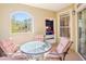 Outdoor patio featuring comfortable seating and a view into the main bedroom at 1230 S Missouri Ave # 704, Clearwater, FL 33756