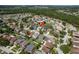 Aerial view showcases the home's location within a well-planned community with a pond at 1246 Ocean Reef Rd, Wesley Chapel, FL 33544