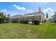 A sprawling lawn, a gas tank, and other houses at 1246 Ocean Reef Rd, Wesley Chapel, FL 33544