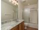 This bathroom offers great light, a large mirror, and a combined tub and shower at 1246 Ocean Reef Rd, Wesley Chapel, FL 33544