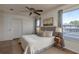 Comfortable bedroom with ceiling fan, neutral decor, and view to the lanai at 1246 Ocean Reef Rd, Wesley Chapel, FL 33544