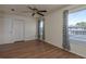 Bright bedroom features a ceiling fan, ample closet space and a large window at 1246 Ocean Reef Rd, Wesley Chapel, FL 33544