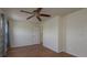 Neutral bedroom with ceiling fan, closet, and lots of natural light at 1246 Ocean Reef Rd, Wesley Chapel, FL 33544