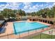 Community pool featuring a large swimming area, ample seating, and a covered lounge space at 1246 Ocean Reef Rd, Wesley Chapel, FL 33544