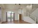 Spacious entryway boasts hardwood floors, a staircase, and plenty of natural light at 1246 Ocean Reef Rd, Wesley Chapel, FL 33544