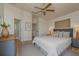 A spacious main bedroom with a ceiling fan and access to an ensuite bathroom at 1246 Ocean Reef Rd, Wesley Chapel, FL 33544