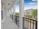 Serene balcony with classic columns and scenic views of the neighborhood at 135 Commonwealth N Ct, St Petersburg, FL 33716