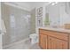 Elegant bathroom with a glass-enclosed shower, stylish vanity, and modern fixtures at 135 Commonwealth N Ct, St Petersburg, FL 33716