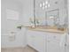 Bright primary bathroom with double vanity, soaking tub, separate glass shower, and modern fixtures at 135 Commonwealth N Ct, St Petersburg, FL 33716
