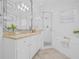 Bright primary bathroom with double vanity, soaking tub, separate glass shower, and modern fixtures at 135 Commonwealth N Ct, St Petersburg, FL 33716