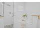 Bright primary bathroom with separate glass shower and soaking tub with modern fixtures at 135 Commonwealth N Ct, St Petersburg, FL 33716