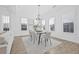 Bright dining area with modern table, chairs, and decorative chandelier, perfect for entertaining guests at 135 Commonwealth N Ct, St Petersburg, FL 33716