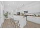 Bright, white kitchen with granite countertops, stainless steel appliances, and a breakfast bar at 135 Commonwealth N Ct, St Petersburg, FL 33716