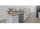 Kitchen with granite countertops, a stainless steel dishwasher, and modern design at 135 Commonwealth N Ct, St Petersburg, FL 33716