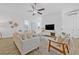 Bright and open living room with lots of natural light, hard wood floors, and modern decor at 135 Commonwealth N Ct, St Petersburg, FL 33716