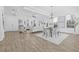 Open concept living area features coffered ceilings, neutral decor, and abundant natural light at 135 Commonwealth N Ct, St Petersburg, FL 33716