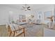 Inviting living room showcasing stylish decor, a ceiling fan, and an open, airy layout at 135 Commonwealth N Ct, St Petersburg, FL 33716