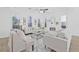 Bright living room with white walls, tray ceiling, fireplace, and plush seating; perfect for relaxation at 135 Commonwealth N Ct, St Petersburg, FL 33716