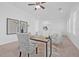 Bright home office with decorative chair, desk, plush chairs, and natural light from large windows at 135 Commonwealth N Ct, St Petersburg, FL 33716