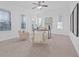 Bright home office with plush chairs, desk, and natural light from large windows at 135 Commonwealth N Ct, St Petersburg, FL 33716