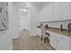 Home office nook with granite countertops, built in cabinets and neutral decor at 135 Commonwealth N Ct, St Petersburg, FL 33716