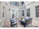 Charming outdoor patio with comfortable seating and a view of the backyard at 135 Commonwealth N Ct, St Petersburg, FL 33716