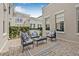 Cozy outdoor patio with modern seating and privacy hedge perfect for relaxing at 135 Commonwealth N Ct, St Petersburg, FL 33716