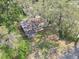 An aerial view of property with mature shade trees and lawn at 1506 E Poinsettia Ave, Tampa, FL 33612