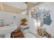 Bathroom featuring a sink, toilet, shower and tub combo with a patterned curtain at 1506 E Poinsettia Ave, Tampa, FL 33612