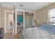 Cozy bedroom featuring a closet and bedside table illuminated by a stylish lamp at 1506 E Poinsettia Ave, Tampa, FL 33612