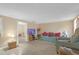 Spacious living room with tile floors providing access to the connecting rooms at 1506 E Poinsettia Ave, Tampa, FL 33612