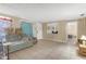 Living room with neutral walls and tiled flooring, offering a versatile living space at 1506 E Poinsettia Ave, Tampa, FL 33612