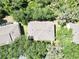 Aerial shot of the roof on the property, surrounded by a lush greenbelt of trees at 15922 Fishhawk Creek Ln, Lithia, FL 33547
