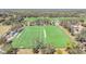 Aerial view of a manicured sports field featuring a football field with yard markers and clear boundaries at 15922 Fishhawk Creek Ln, Lithia, FL 33547