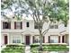 View of the townhouse exterior, showcasing the well-maintained landscaping and architectural details at 15922 Fishhawk Creek Ln, Lithia, FL 33547