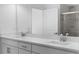 Bathroom featuring double sinks with quartz countertops and modern fixtures at 16247 Little Auk Rd, Weeki Wachee, FL 34614