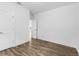 Neutral bedroom featuring modern wood flooring, white walls and trim, and lots of sunlight at 16247 Little Auk Rd, Weeki Wachee, FL 34614