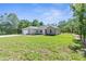 Inviting single-Gathering home with neat front yard and well-maintained lawn under clear sky at 16247 Little Auk Rd, Weeki Wachee, FL 34614