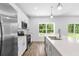 Bright kitchen with an island, stainless steel appliances, and a backyard view at 16247 Little Auk Rd, Weeki Wachee, FL 34614