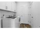 Laundry room with modern appliances and ample storage space at 16247 Little Auk Rd, Weeki Wachee, FL 34614