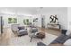 Well-decorated living room with modern furniture, wood floors, and an open layout at 16247 Little Auk Rd, Weeki Wachee, FL 34614