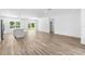 Spacious and airy living room with wood floors and a view to the backyard at 16247 Little Auk Rd, Weeki Wachee, FL 34614