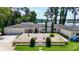 Beautiful single-story home with lush landscaping, brick-paved entry, and stunning lake views at 16315 Lonely Ln, Odessa, FL 33556