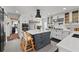 Chic kitchen with an island, stainless steel appliances, and a view into other rooms at 16315 Lonely Ln, Odessa, FL 33556
