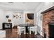 Cozy living room featuring a fireplace, dining area, and stylish decor with modern accents at 16315 Lonely Ln, Odessa, FL 33556