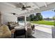 Inviting outdoor space with a covered patio, pool, and views of the lush backyard and lake at 16315 Lonely Ln, Odessa, FL 33556