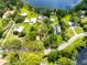 Aerial of lakeside homes surrounded by trees, close to lake access and scenic water views at 16603 Hutchison Rd, Odessa, FL 33556