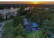 Charming home with screened-in pool, detached garage, and long driveway on a sprawling lot at 16603 Hutchison Rd, Odessa, FL 33556